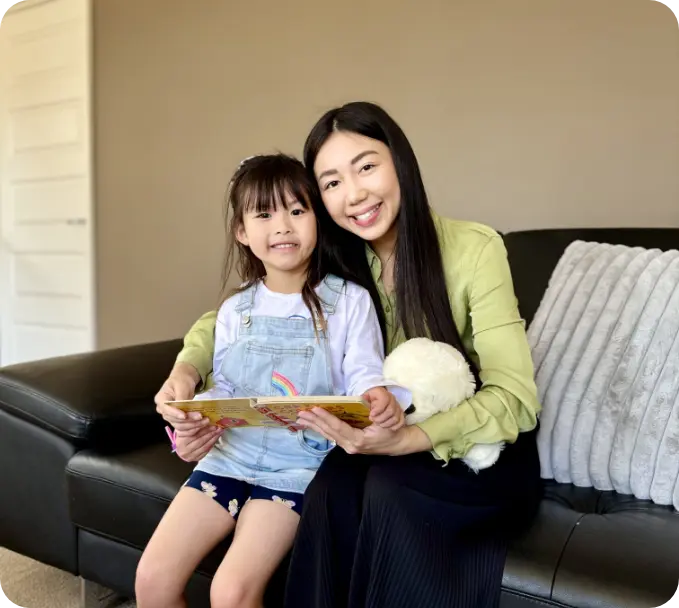 vanessa-and-girl-sitting-and-reading-together